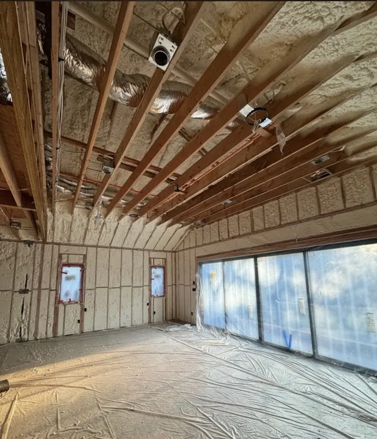 Interior walls and ceiling insulated with spray foam during new construction in Irondale